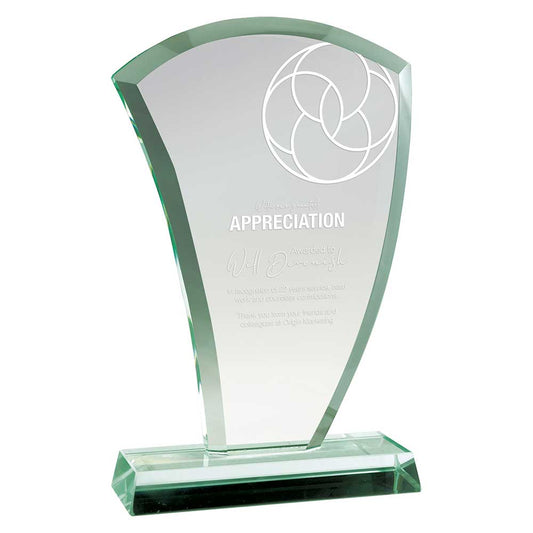 Clear glass award with engraved text on a white background