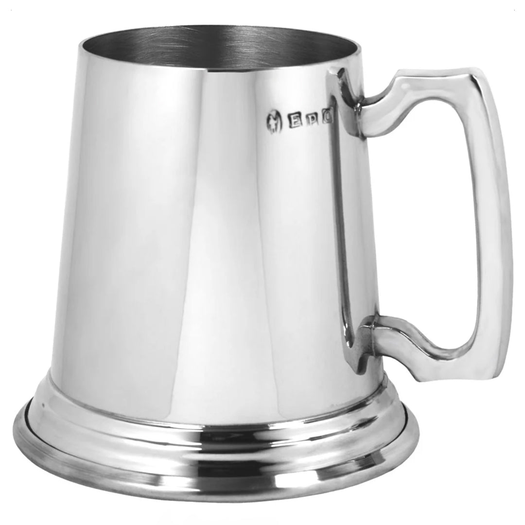 Silver tankard with a handle on a white background