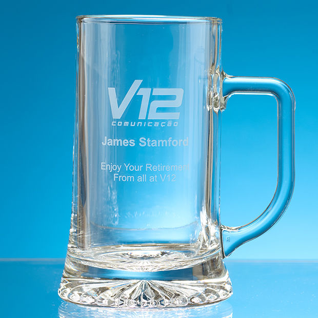 Clear glass mug with engraved text on a blue background and an engraving included banner.