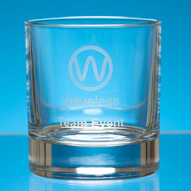 Clear glass with 'waveless Team Event' engraving on a blue background