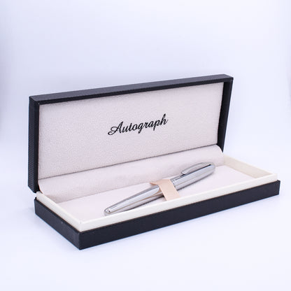 Silver pen in an open 'Autograph' box on a white background