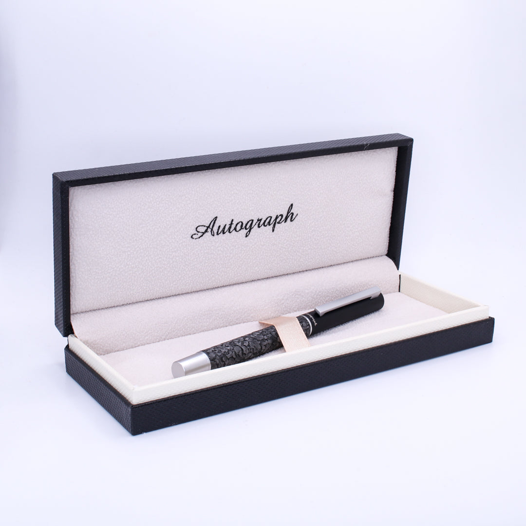 Fountain pen in an open 'Autograph' box on a white background