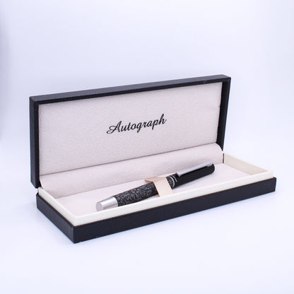 Fountain pen in an open 'Autograph' box on a white background