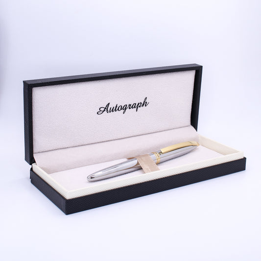 Silver pen in an open black and beige box with 'Autograph' text on a white background