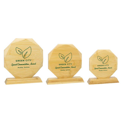 Three wooden awards with 'Green City' branding on a white background