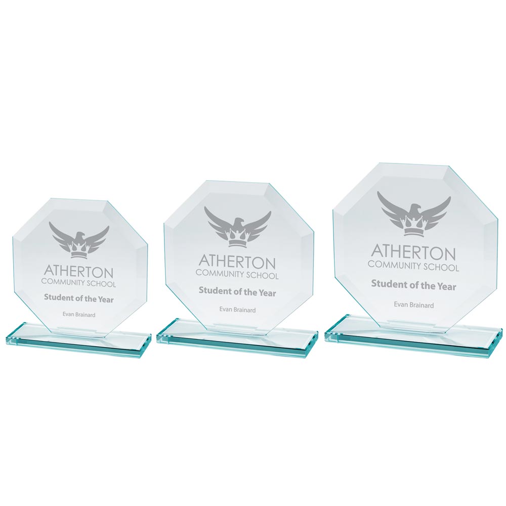Three octagonal glass awards with 'Atherton Community School Student of the Year' engraved on them.