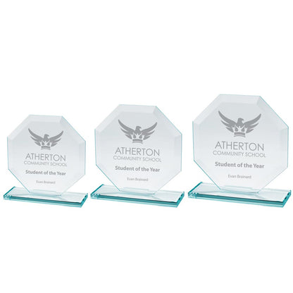 Three octagonal glass awards with 'Atherton Community School Student of the Year' engraved on them.