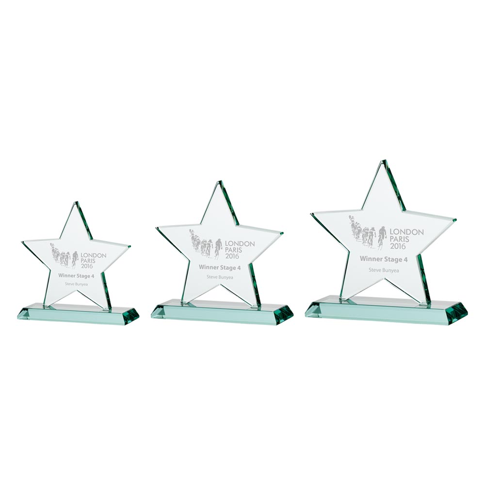 Three star-shaped glass awards on a white background