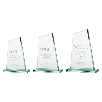 Three glass awards in varying sizes with 'Vogue' text on a white background