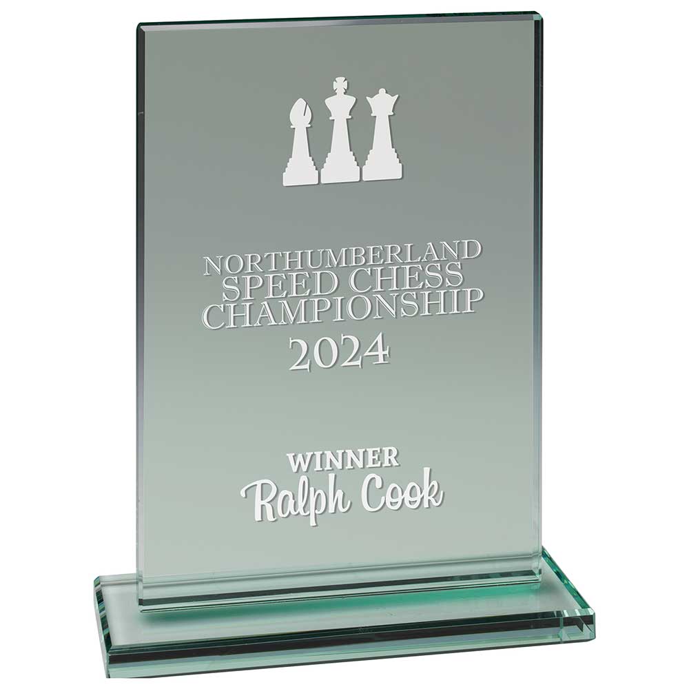 Glass award for Northumberland Speed Chess Championship 2024 with engraved text and chess piece design.