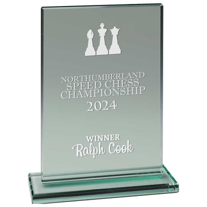 Glass award for Northumberland Speed Chess Championship 2024 with engraved text and chess piece design.