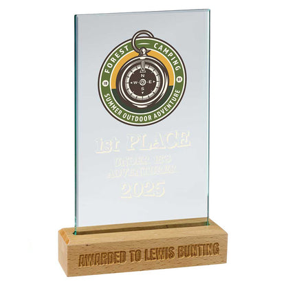 Glass award with wooden base featuring a compass design and text on a white background