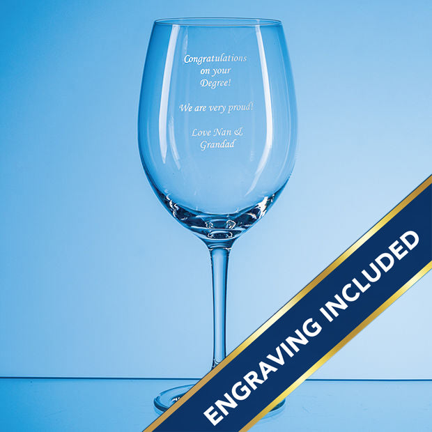 Clear wine glass with engraved text on a blue background and an engraving included banner.
