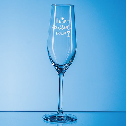 Clear wine glass with 'Time to Swine Down' text on a blue background